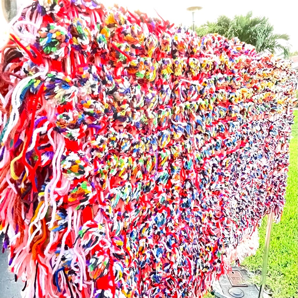 Hand made multi crocheted & fringed colorful open knit blanket or wall hanging.